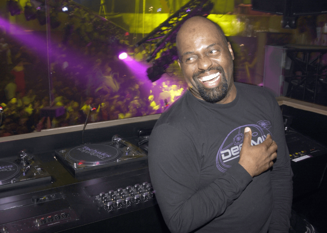 Frankie Knuckles in DJ booth.